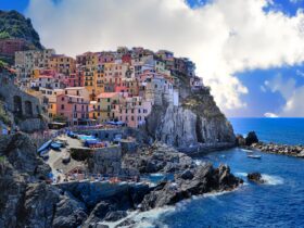 Assorted-color Houses Beside Body of Water